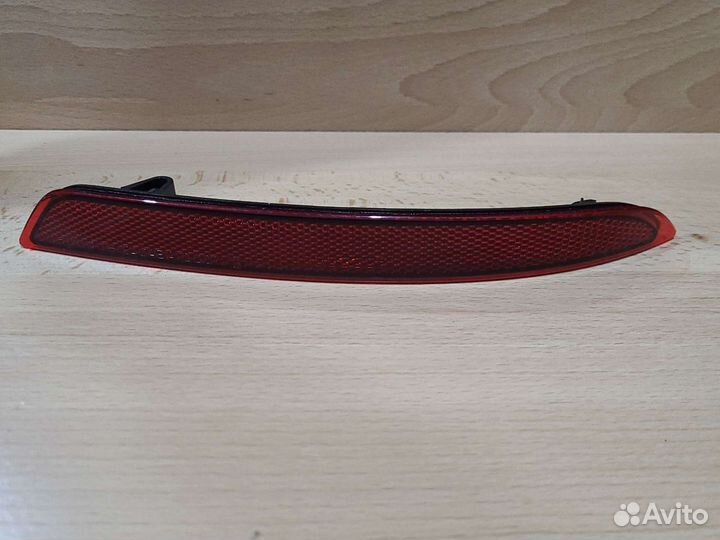 Катафот заднего бампера Opel Astra J