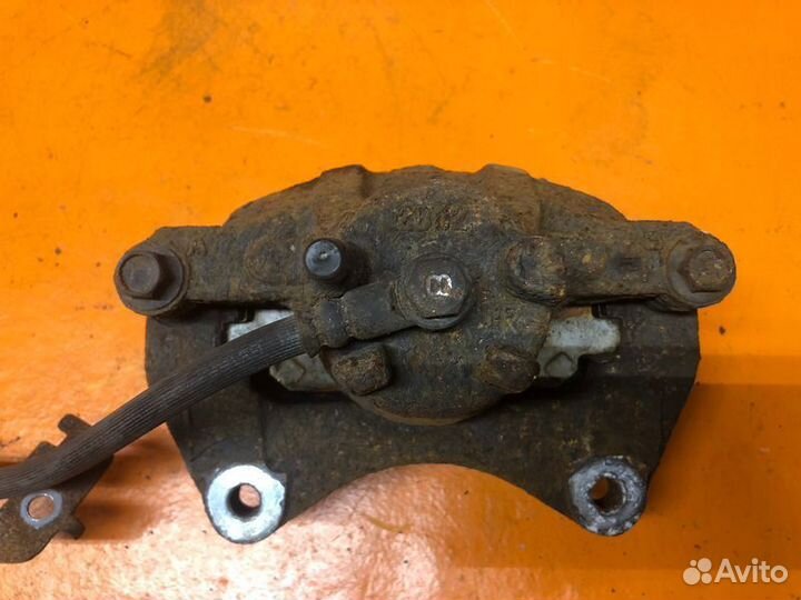 Суппорт тормозной передний левый Jeep Compass MK49
