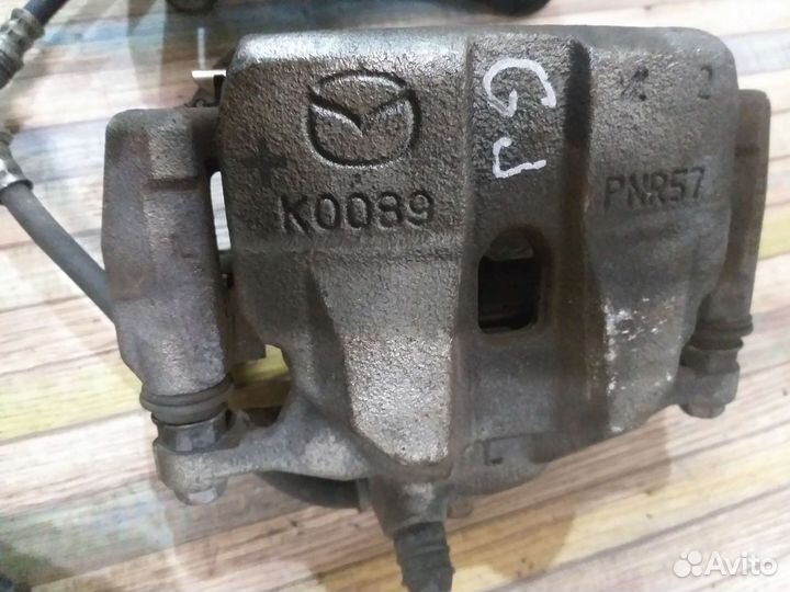 Передний суппорт mazda 6GJ