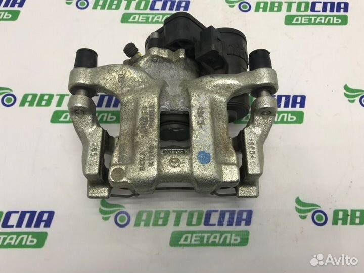 Суппорт тормозной задний правый Mazda 3 BP PE / P5