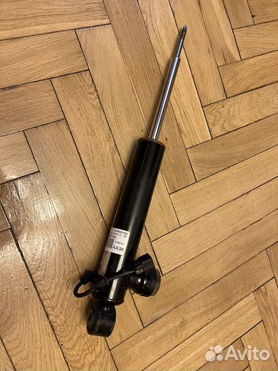 Амортизатор задний левый Cadillac SRX2