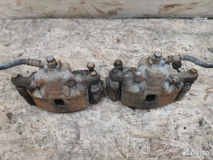 Суппорт тормозной передний Suzuki Liana 1.6 M16A