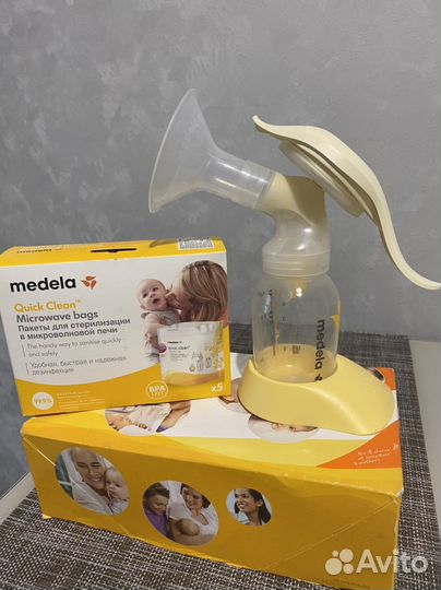 Молокоотсос ручной Medela+пакеты для стерилизации