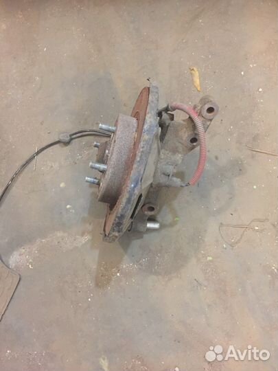 Киа спектра 2008г кулак поворотный передний левый