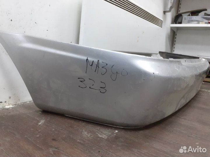 Бампер задний Mazda 323