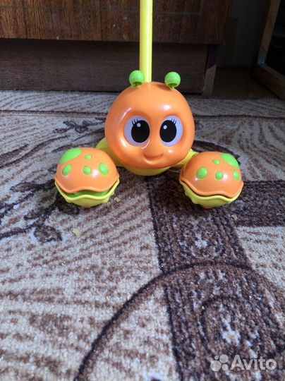 Игрушка каталка с ручкой