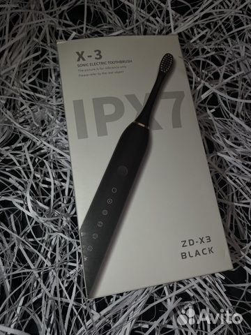 Электрическая зубная щетка