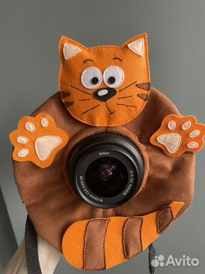 Игрушка на объектив фотоаппарата