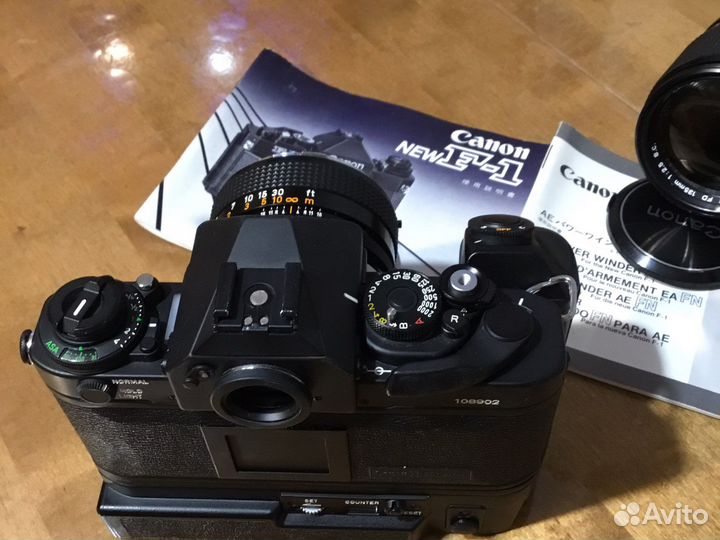Canon new F-1 + FD 50mm/1,4 + FD 135mm/2,5s.c