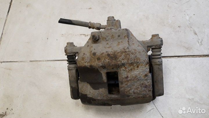 Суппорт передний правый Nissan Almera