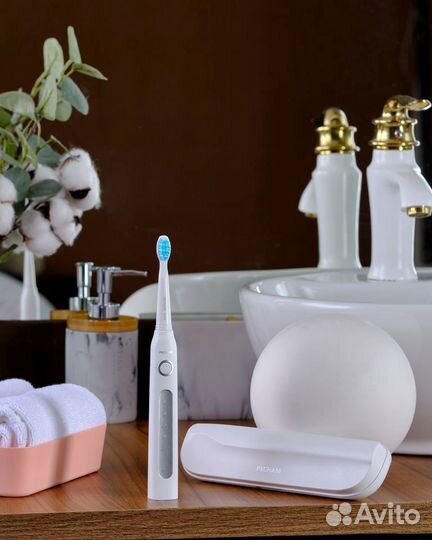 Электрическая зубная щетка