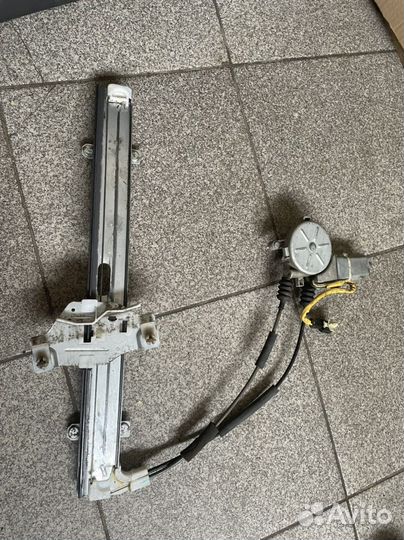 Стеклоподъемник передний левый Kia Spectra