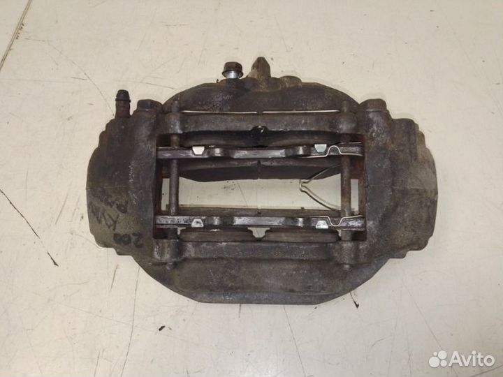 Суппорт тормозной передний левый Toyota Land