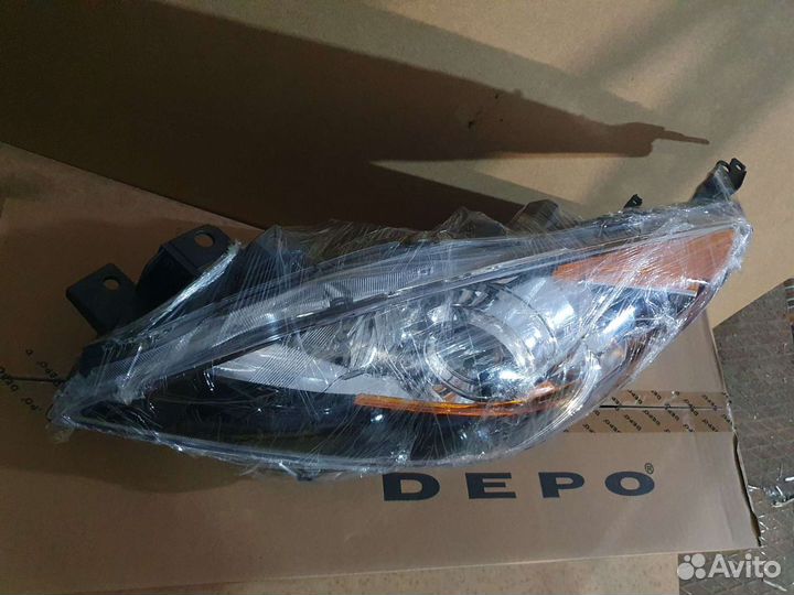 Фара левая Mazda 3 2009-2011