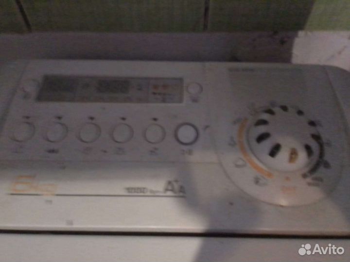 Стиральная машина Candy с вертикальной загрузкой