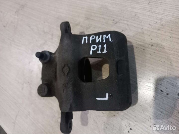 Тормозной суппорт Nissan Primera P11 левая