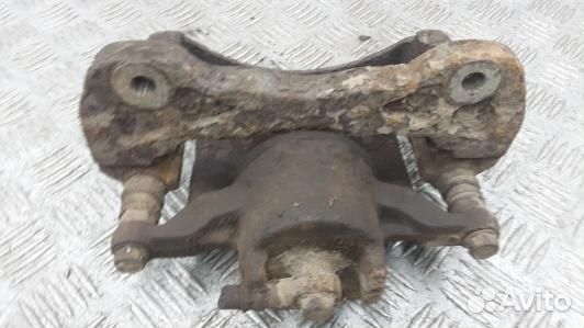 Суппорт тормозной передний левый mitsubishi L200 K