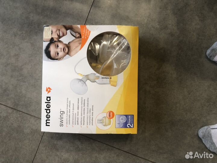 Молокоотсос medela электрический