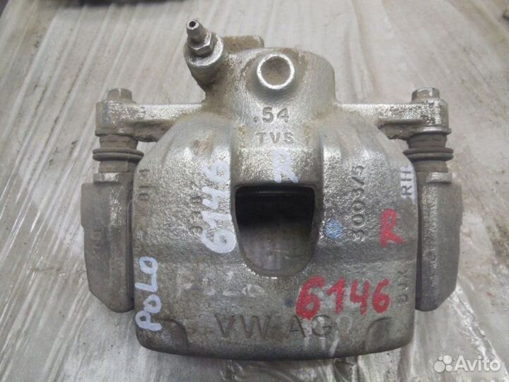 Суппорт тормозной передний Volkswagen Polo 5