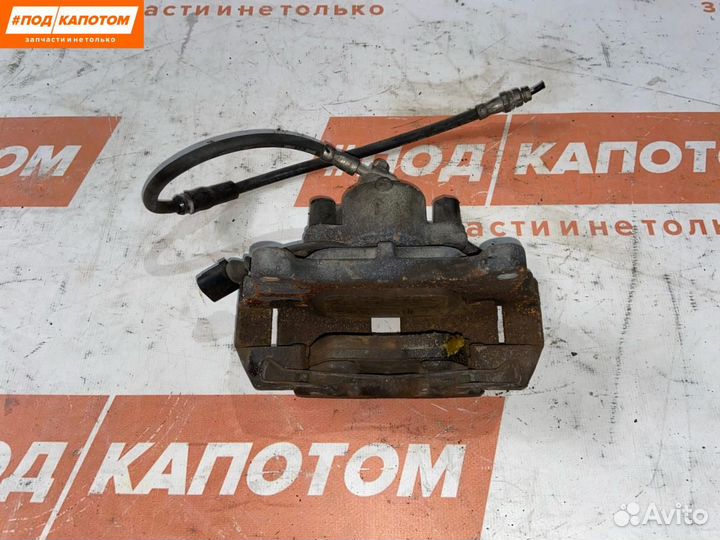 Суппорт тормозной передний левый Volkswagen Caddy