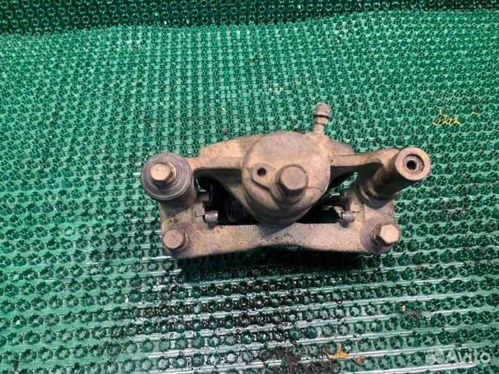 Суппорт тормозной левый Toyota Vista SV35 3SFE