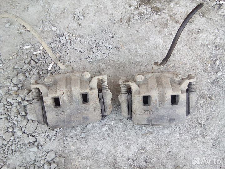 Суппорта передние Ниссан Навара Патфайндер