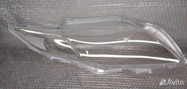 Стекло фары Toyota Corolla E150