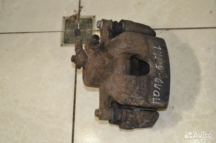 Тормозной суппорт передний левый Volkswagen Polo 5