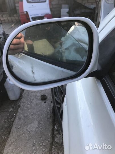 Зеркало левое на Nissan March 1.2л. 2005