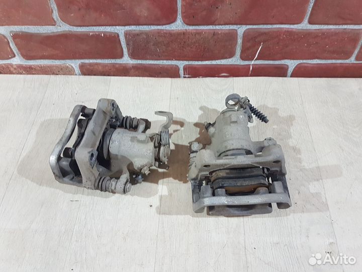 Суппорт задний левый Opel astra h