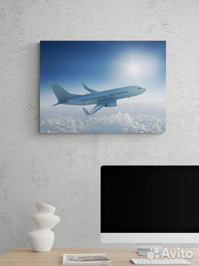 Картина с пассажирским самолетом в небе