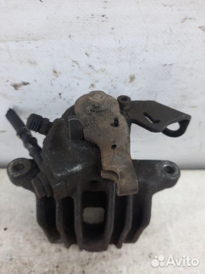 Суппорт тормозной задний левый Volkswagen Golf