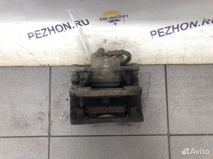 Суппорт тормозной передний правый Nissan Note