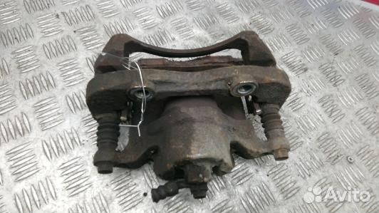 Суппорт тормозной передний правый nissan NV200 (1B