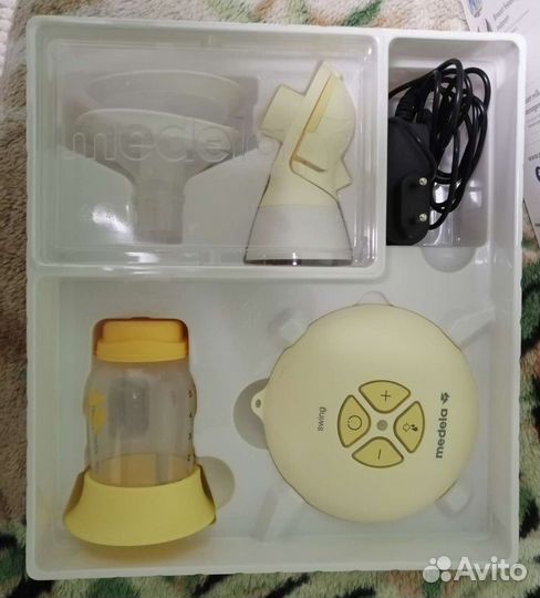 Молокоотсос medela электрический
