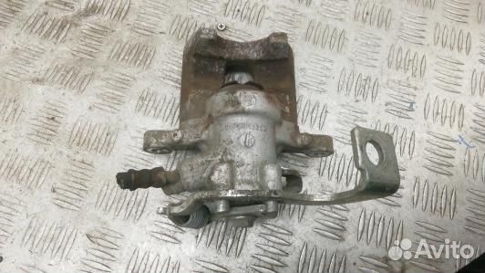 Суппорт тормозной задний левый toyota corolla E15