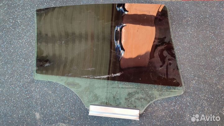 Стекло двери заднее левое Opel Astra H седан