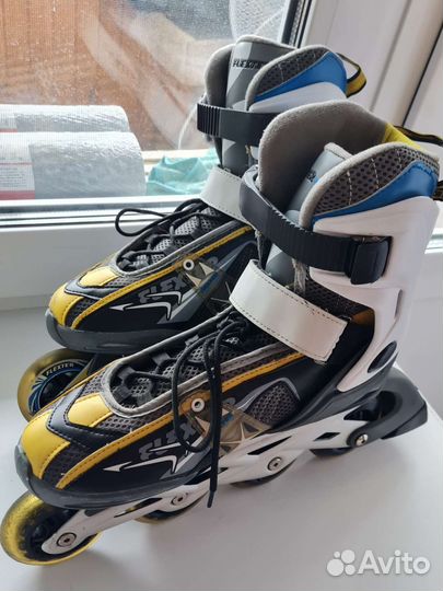 Роликовые коньки