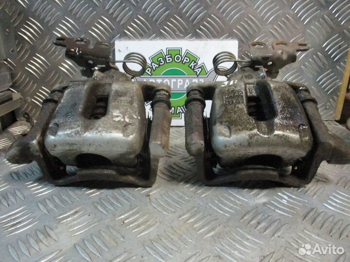 Суппорт тормозной задний L Volkswagen Caddy 3 07г