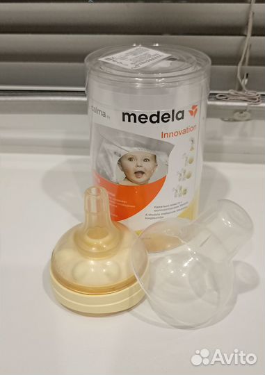 Молокоотсос ручной Medela + соска Calma+ накладки