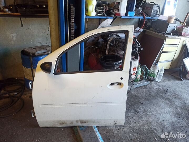 Дверь передняя левая renault logan 1