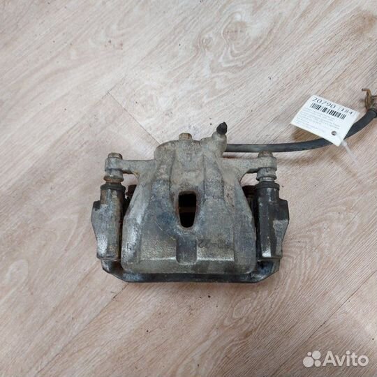 Суппорт тормозной передний левый Toyota Corolla