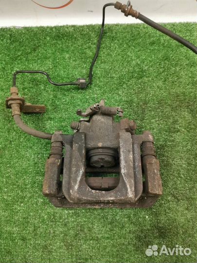 Суппорт тормозной задний левый Dodge Journey 2.4