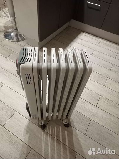 Масляный обогреватель Delonghi