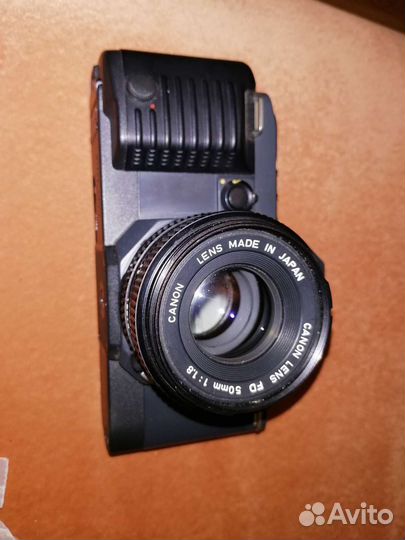 Плёночный фотоаппарат. Саnon t70. Minolta x-7