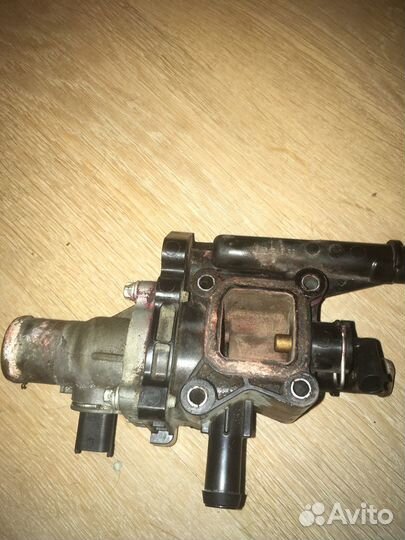 Корпус термостата в сборе на Aveo Т300 артикул 555