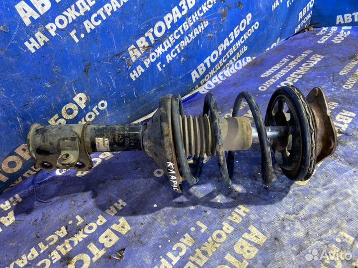 Передняя левая стойка амортизатора Kia Clarus