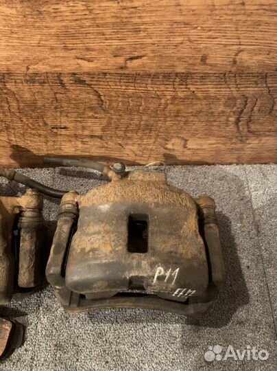 Суппорт передний левый primera p11