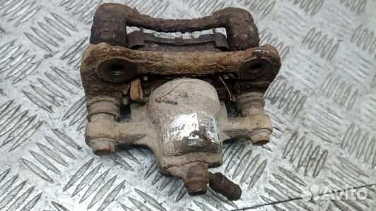 Суппорт тормозной задний левый KIA sportage 3 (7NK