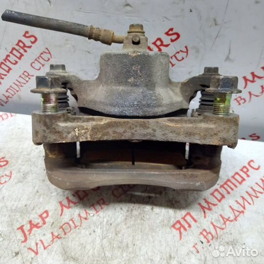 Суппорт тормозной передний левый Nissan Teana J32